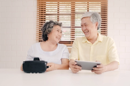 Asian Elderly Couple Using Tablet Virtual Reality Simulator Playing Games Living Room Couple Feeling Happy Using Time Together Lying Table Home